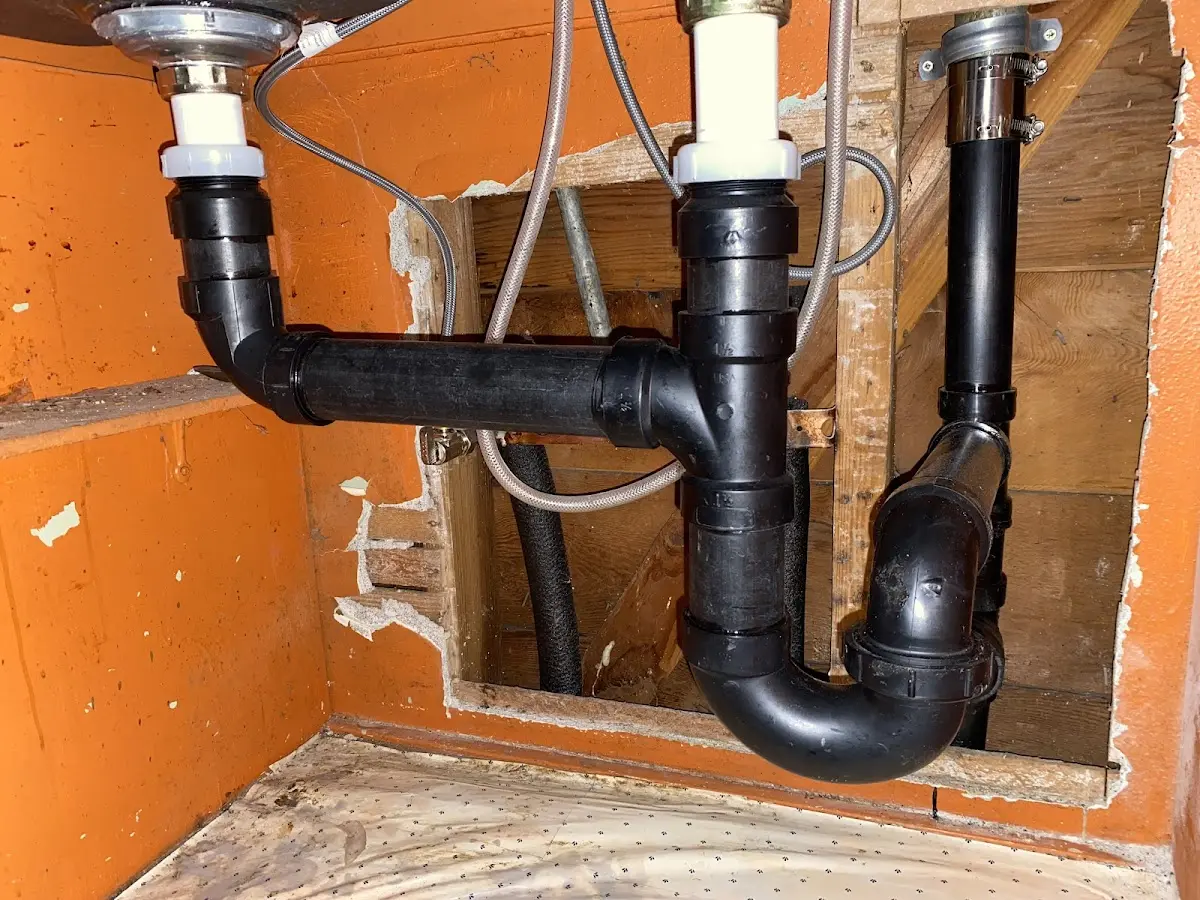 Professional Garbage Disposal Repair equipment and tools on the job in Denver City
